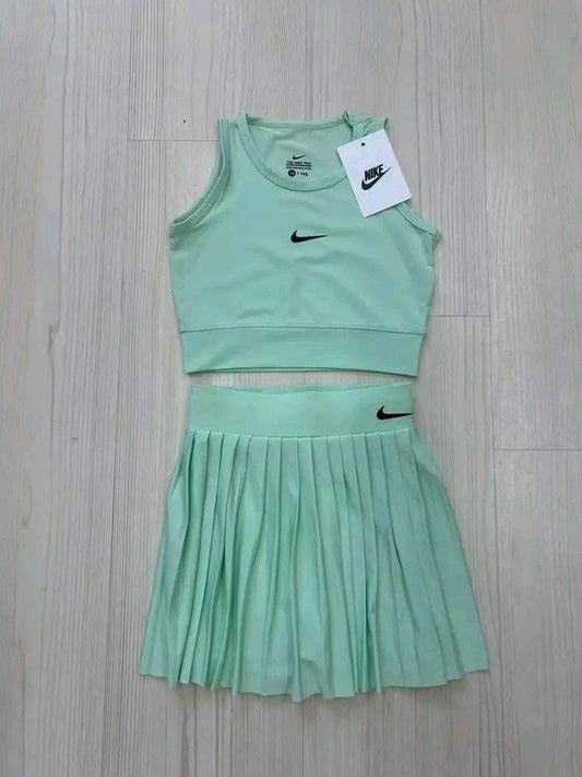 Dri-FIT women's cropped top and a pleated tennis skirt