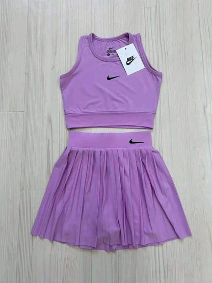 Dri-FIT women's cropped top and a pleated tennis skirt