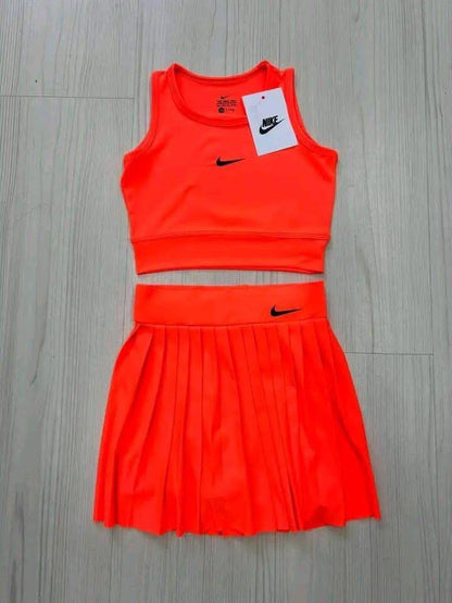 Dri-FIT women's cropped top and a pleated tennis skirt